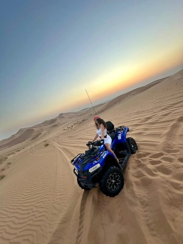 A 4x4 dune bashing across quiet morning dunes on a Dubai morning desert safari