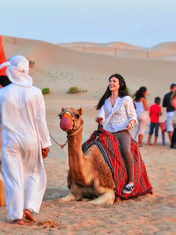 Family Desert Safari Dubai — camel ride with children